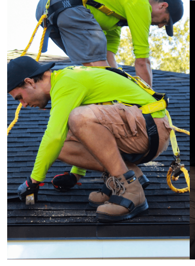 roofers installing shingles on new rood with harness in syracuse